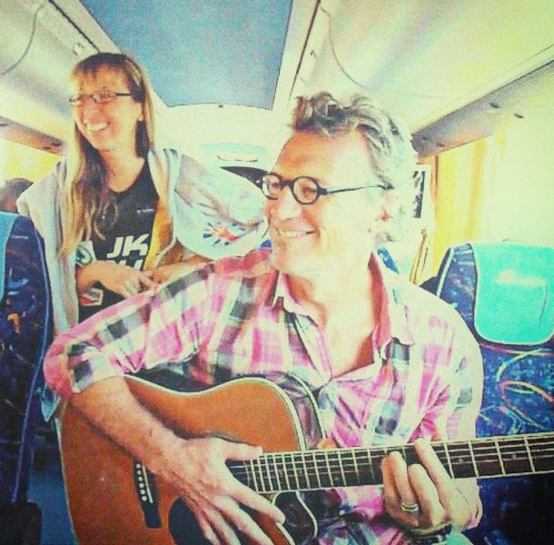 Team - John Kirwan playing guitar